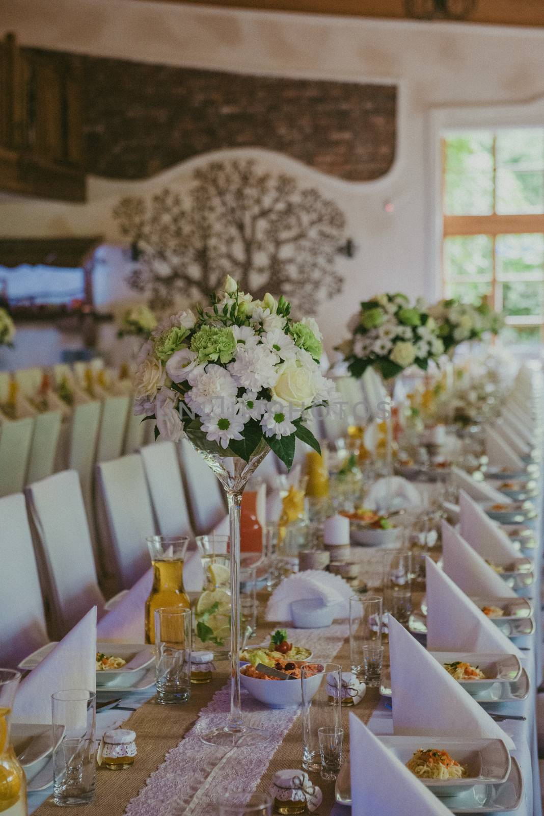Beautifully decorated wedding table and other details at wedding hall. Wedding day