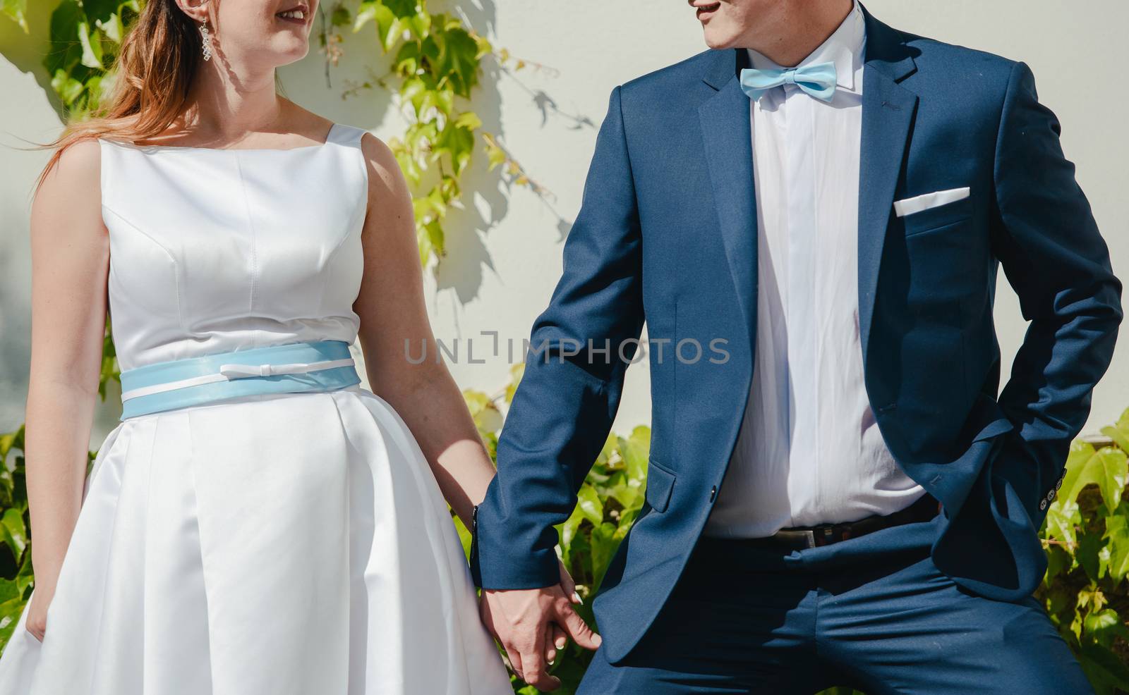 Bride and groom at a photo session in the nature.