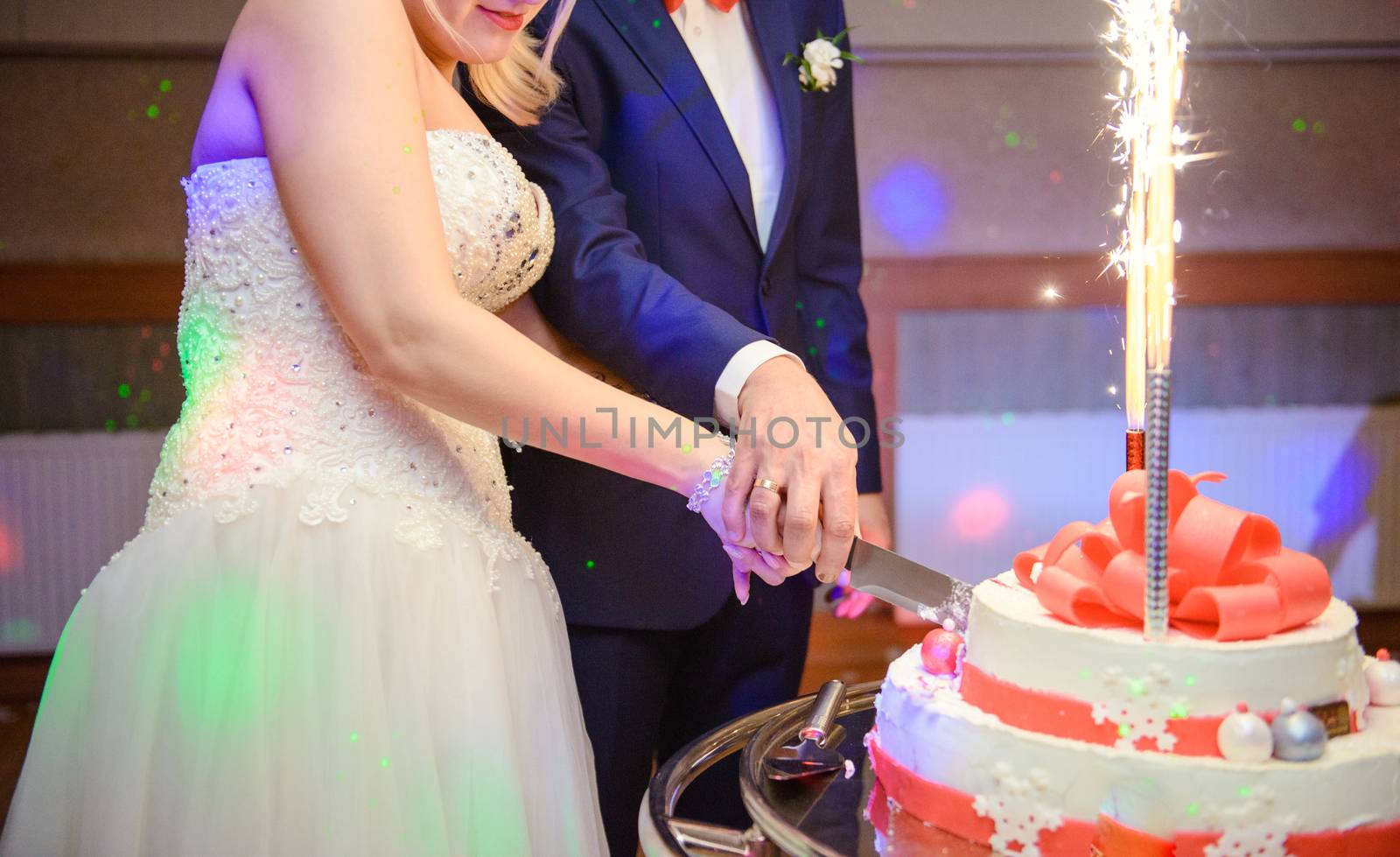 Delicious Wedding Cake at the party. Smoke and fire effects