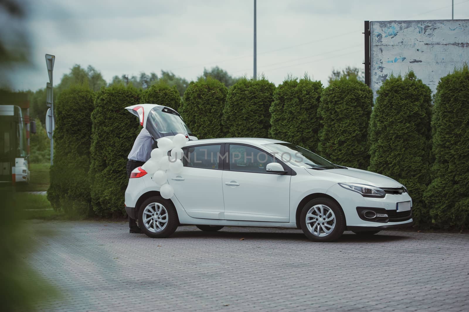 Luxury wedding car decorated with beautiful flowers. Brides and grooms wedding day
