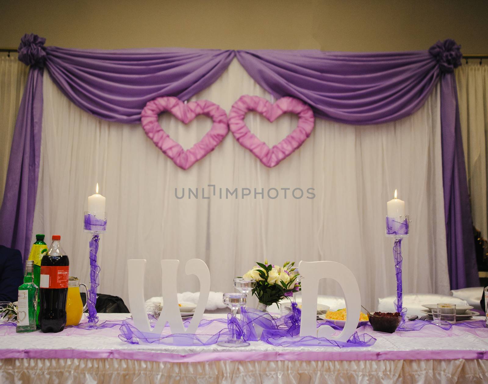 Beautifully decorated wedding table and other details at wedding hall. Wedding day