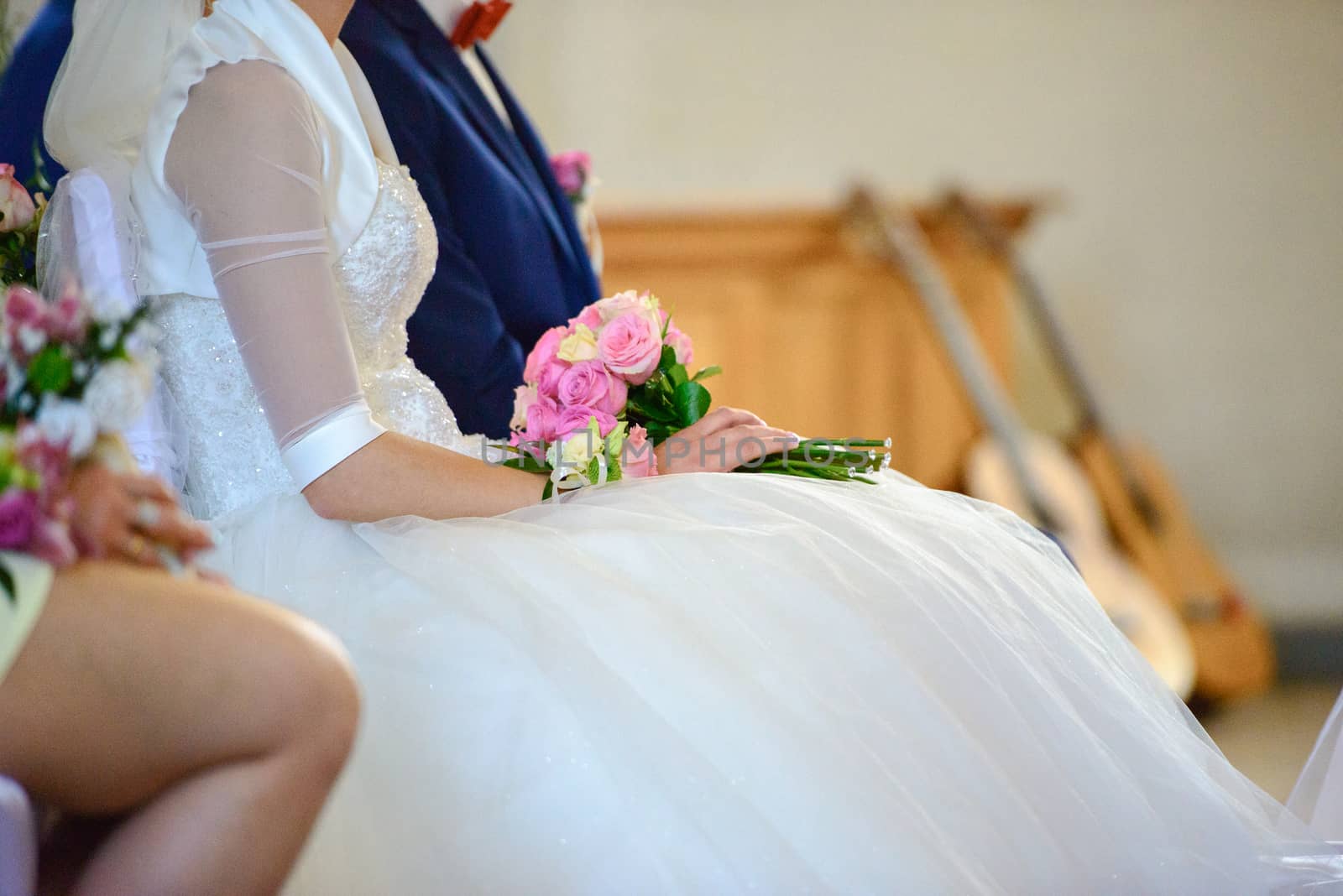 Bride and groom at church wedding during ceremony. Beautiful decoration