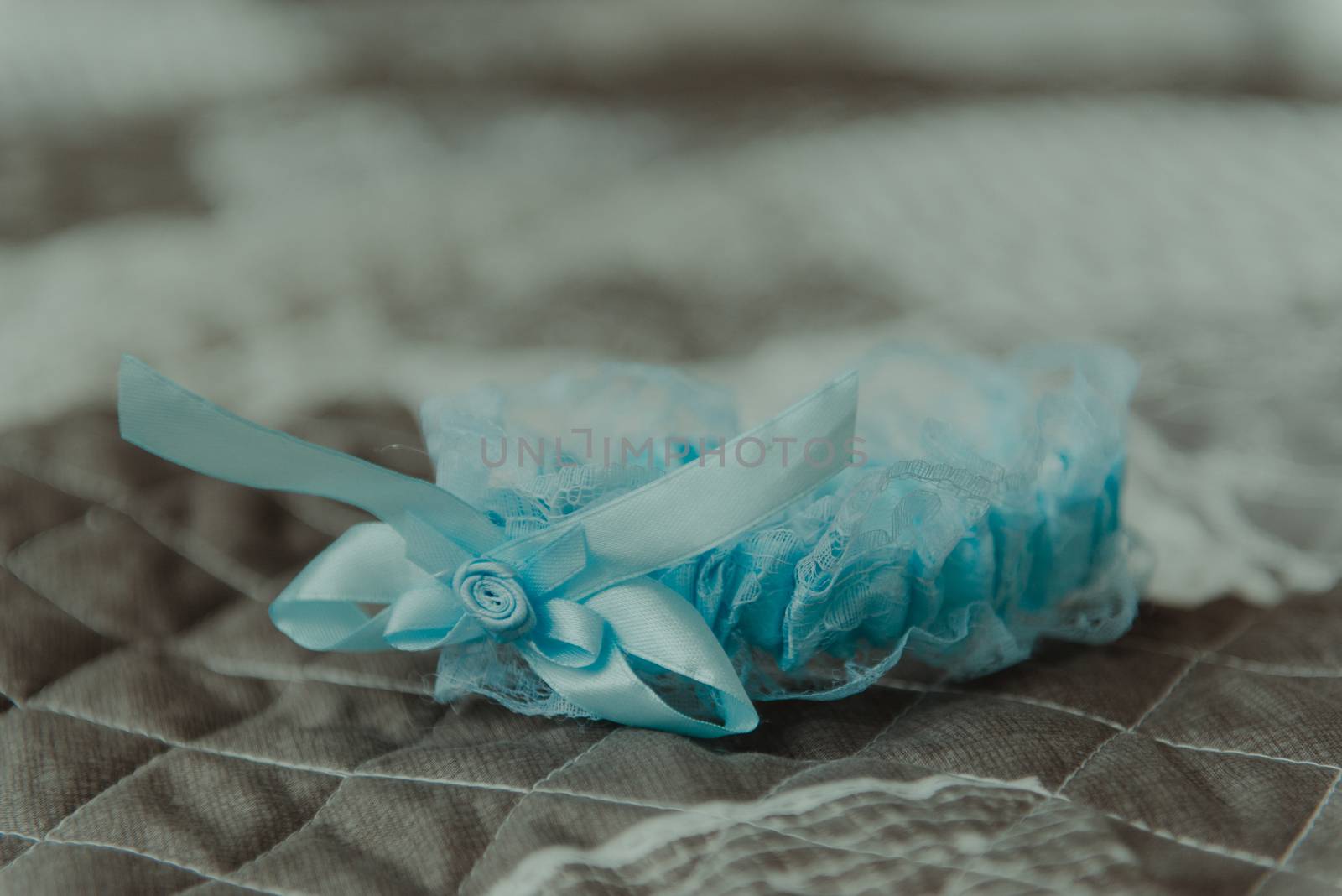 Bridesmaid helping slender bride lacing her wedding white dress, buttoning on delicate lace pattern with fluffy skirt on waist. Morning bridal preparation details newlyweds. Wedding day moments, wear.