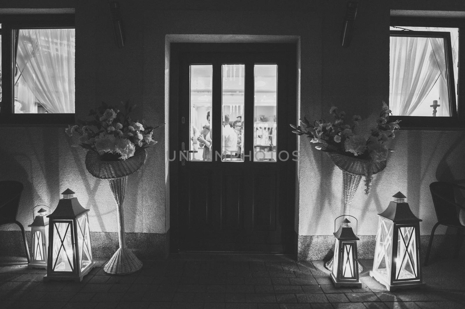 Wedding reception in the open air. Decorated chairs, flowers, candles