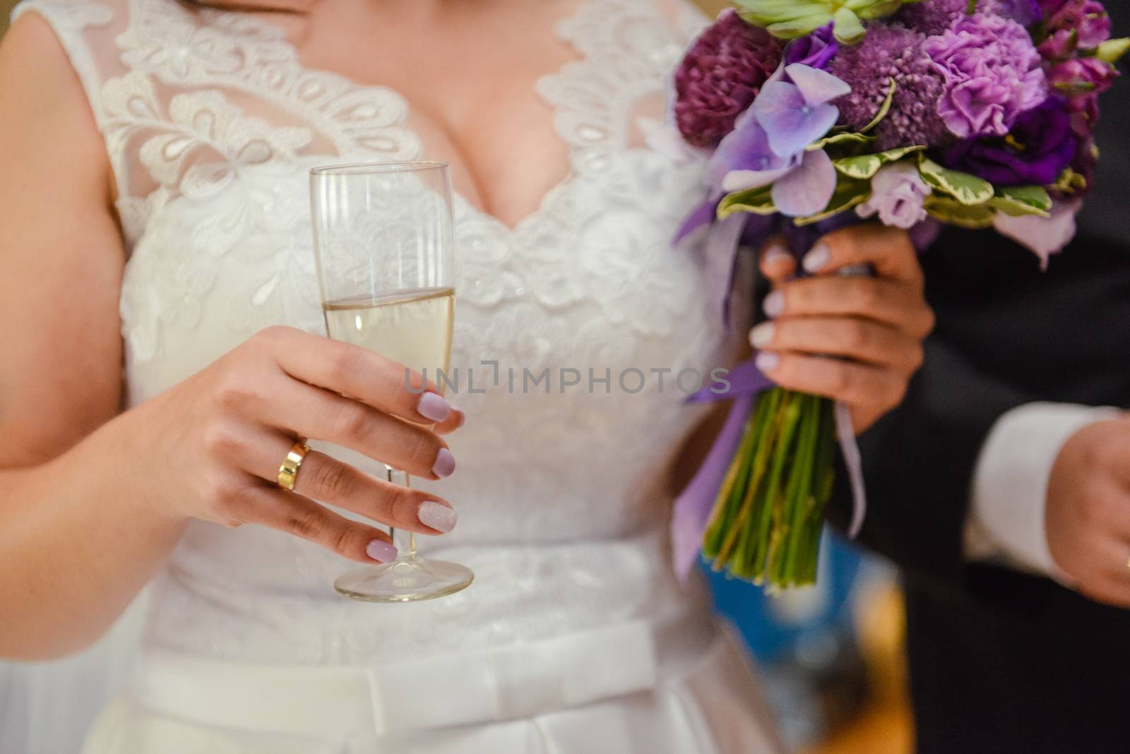 first toast of the bride and groom with a glass of champagne