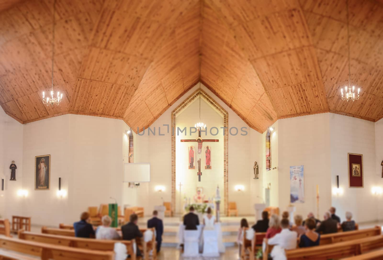 Bride and groom at church wedding during ceremony. Beautiful decoration