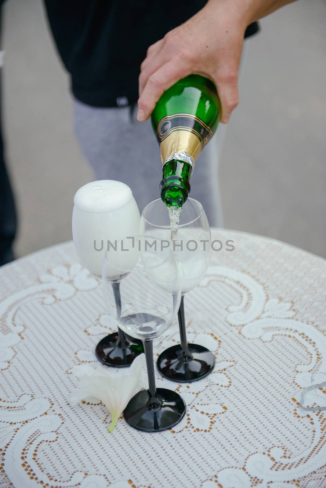 first toast of the bride and groom with a glass of champagne