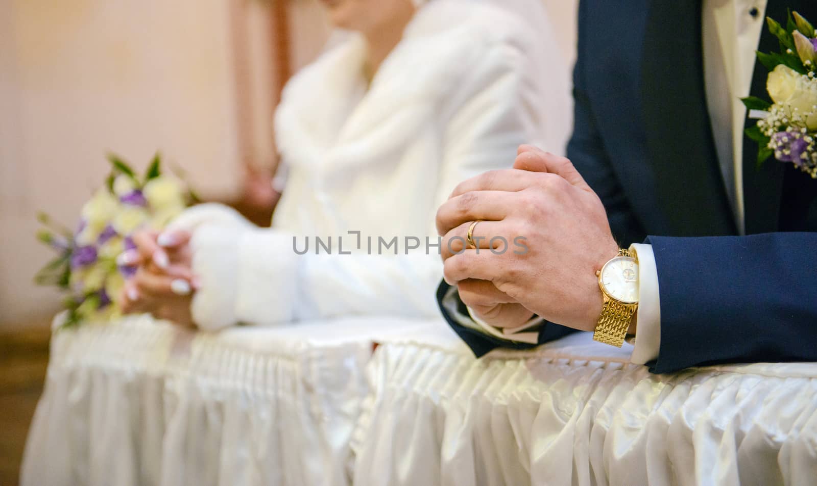 Bride and groom at church wedding during ceremony. Beautiful decoration