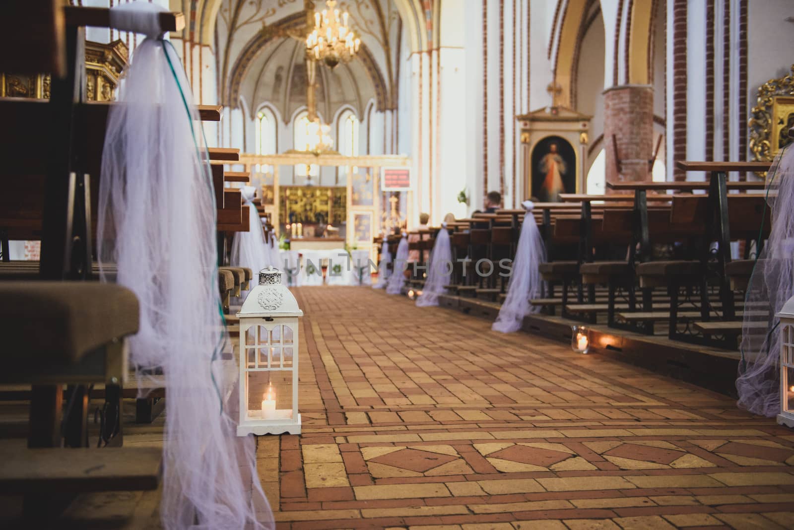 Church sanctuary before a wedding ceremony. Empty chairs for bride and groom