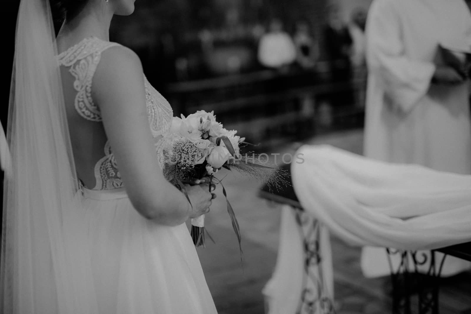 Bride and groom at church wedding during ceremony. Beautiful decoration