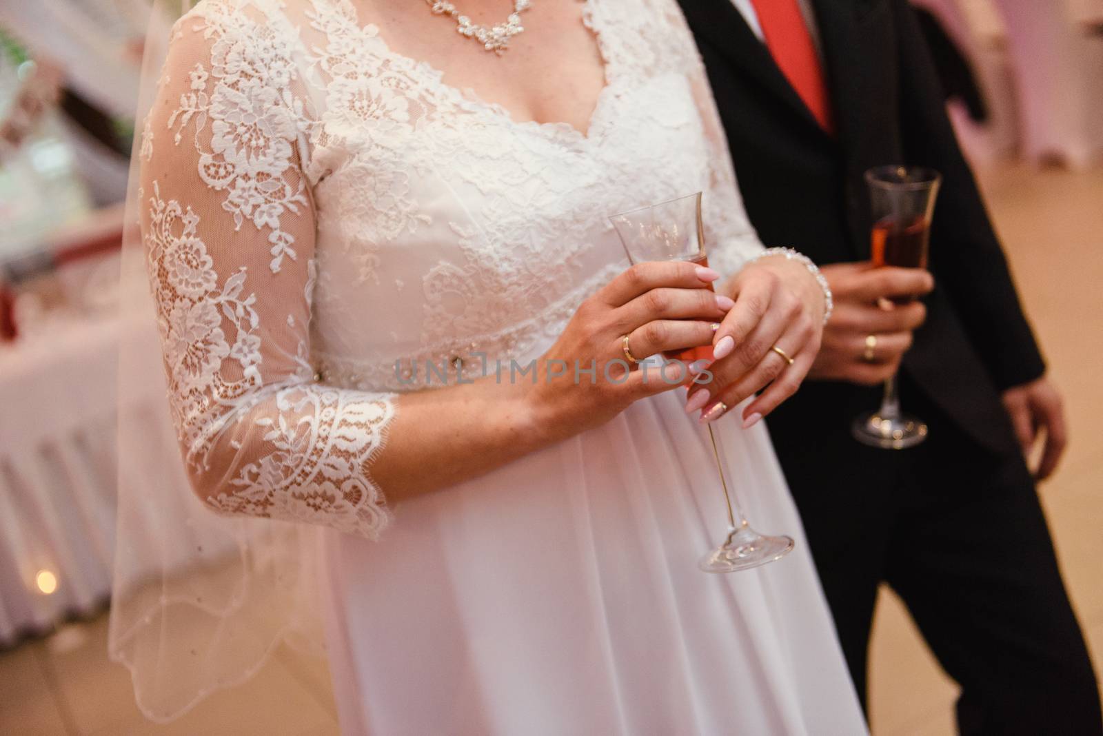first toast of the bride and groom with a glass of champagne