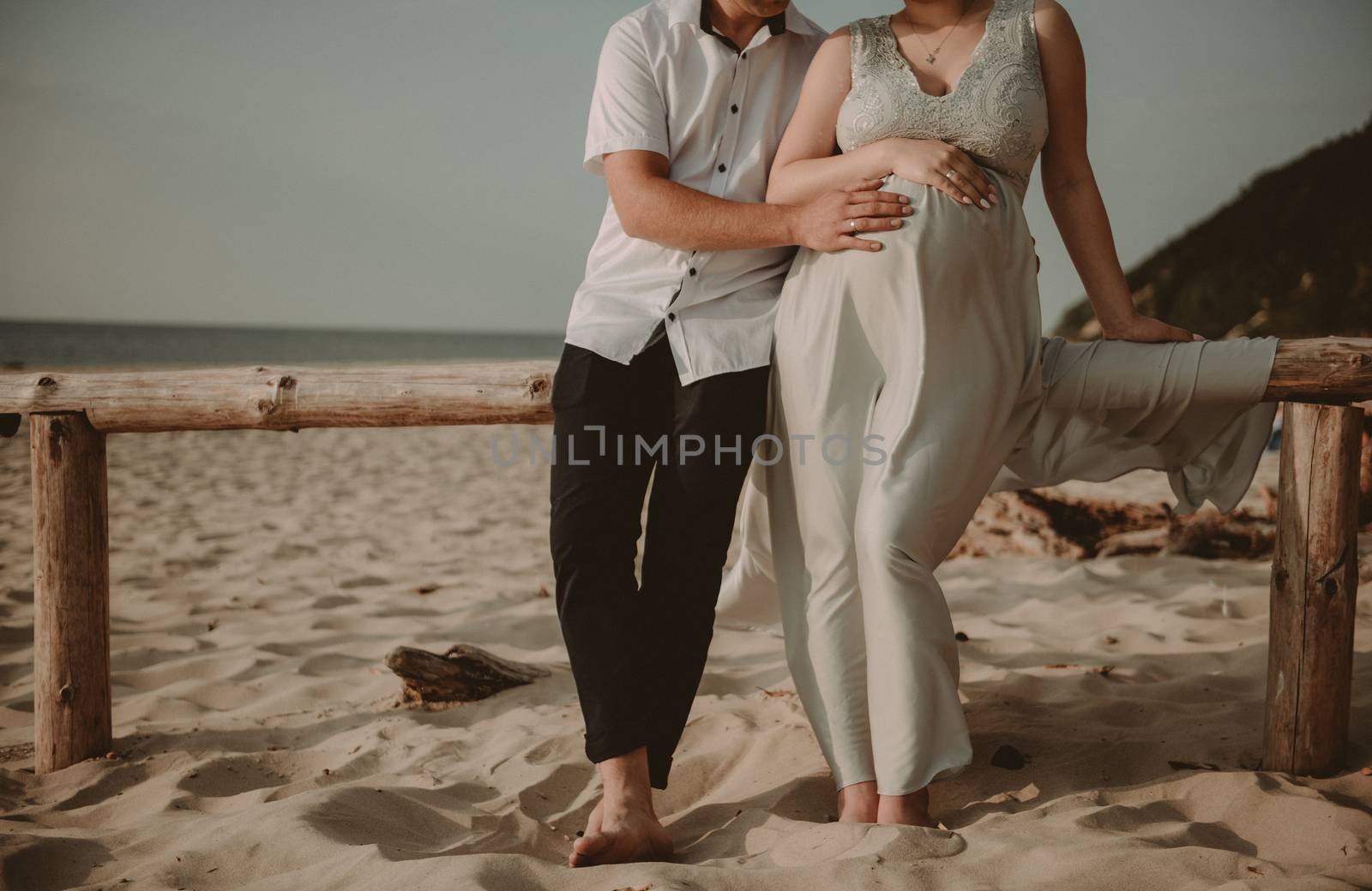 Bride and groom at a photo session in the nature. Baltic sea beach.