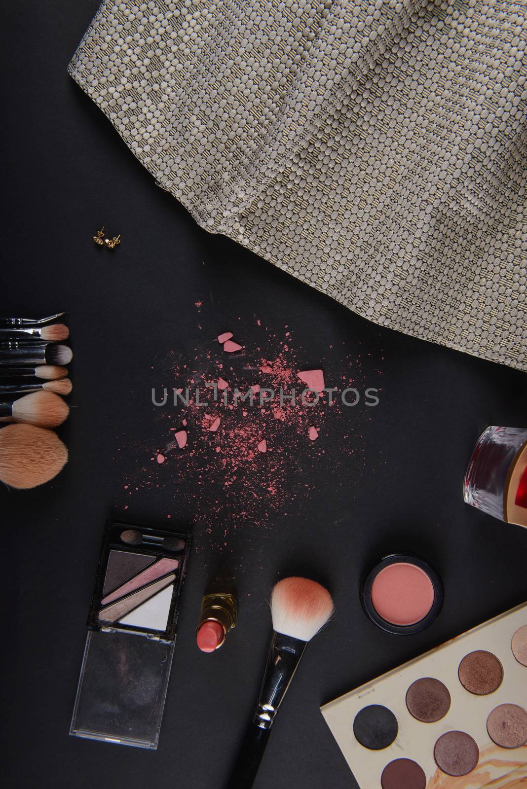 close up of a make up powder and a brush. makeup brush with powder foundation