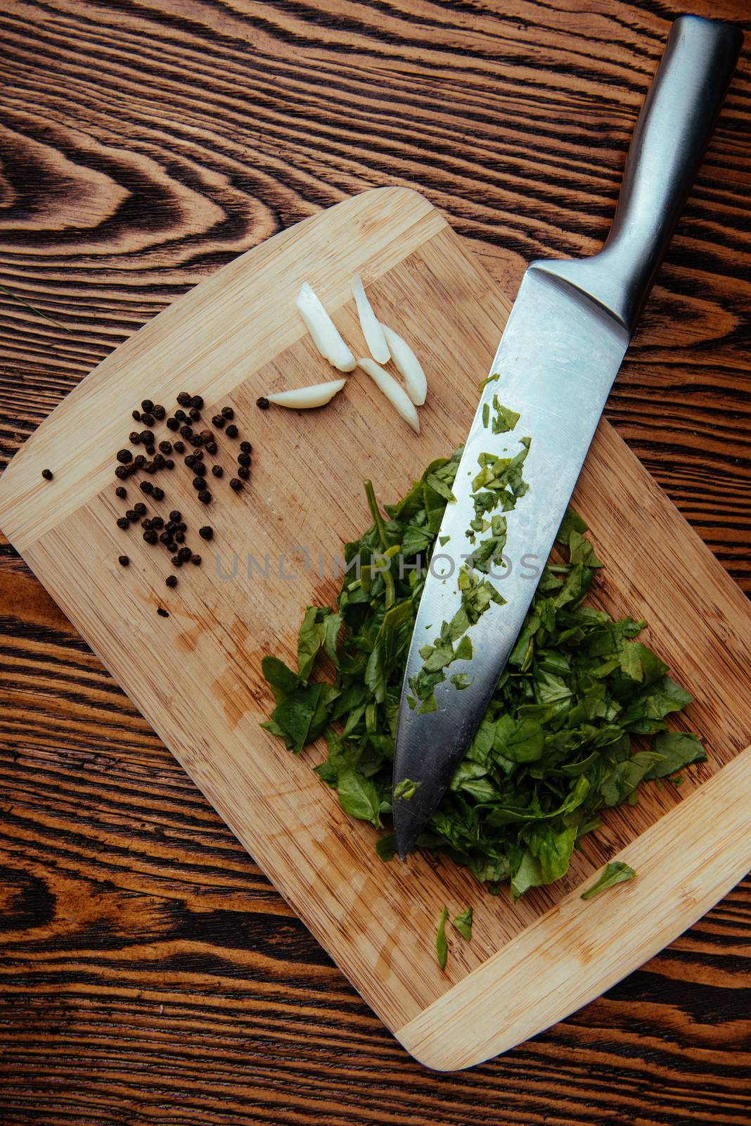 composition poured olive oil, mushrooms, garlic on wooden background. healthy food