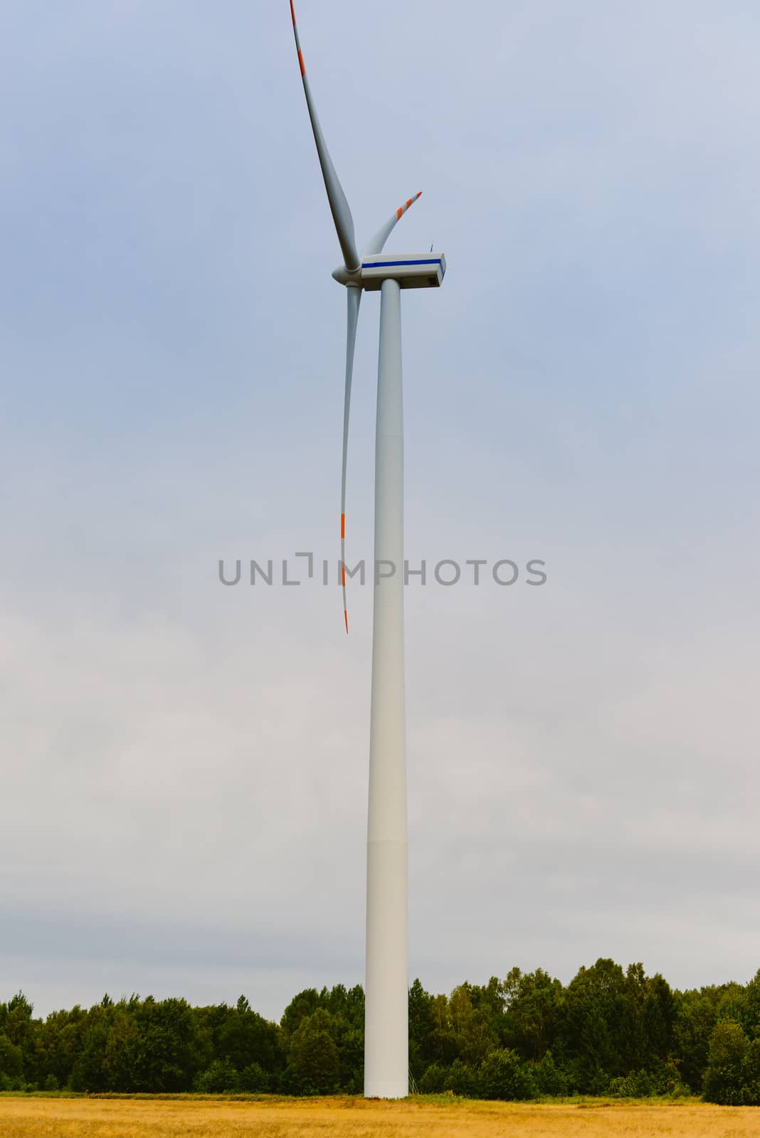 Windturbine. Eco power renewable energy production from wind. Windmill saves the earth's natural ingredients. Green ecology and pure electricity.