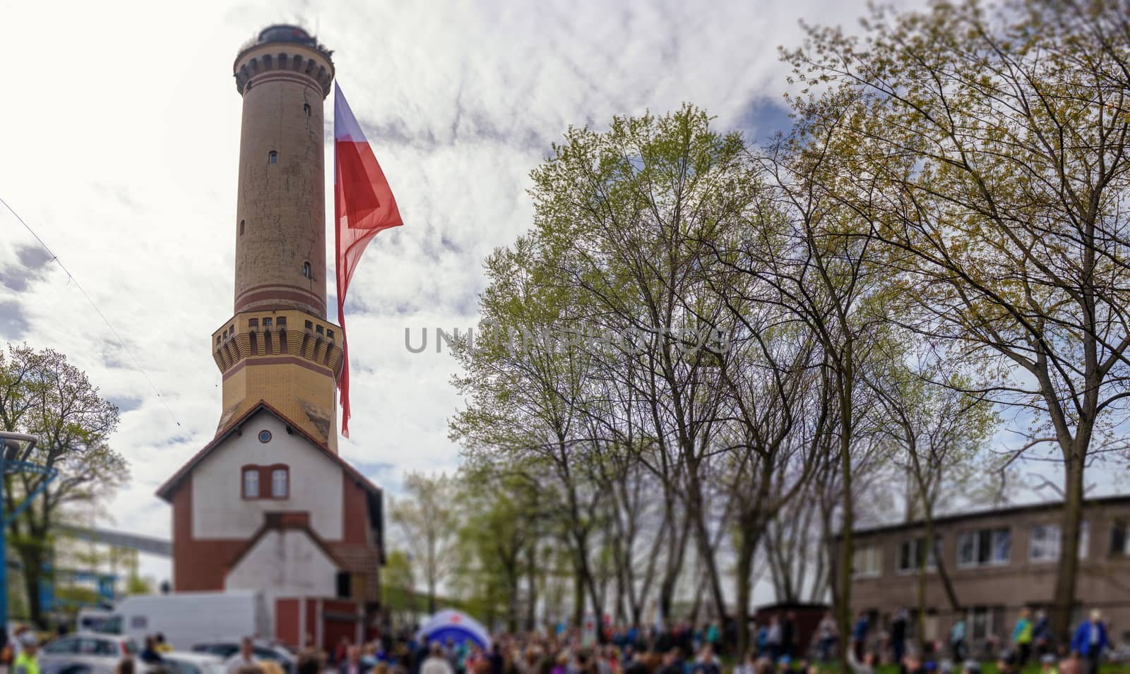 Polish flag hung on at historical lighthouse located in Swinoujscie, Poland, The construction was build in 1828 and height is 65 meters. 19th century. Top tallest Lighthouse in the World