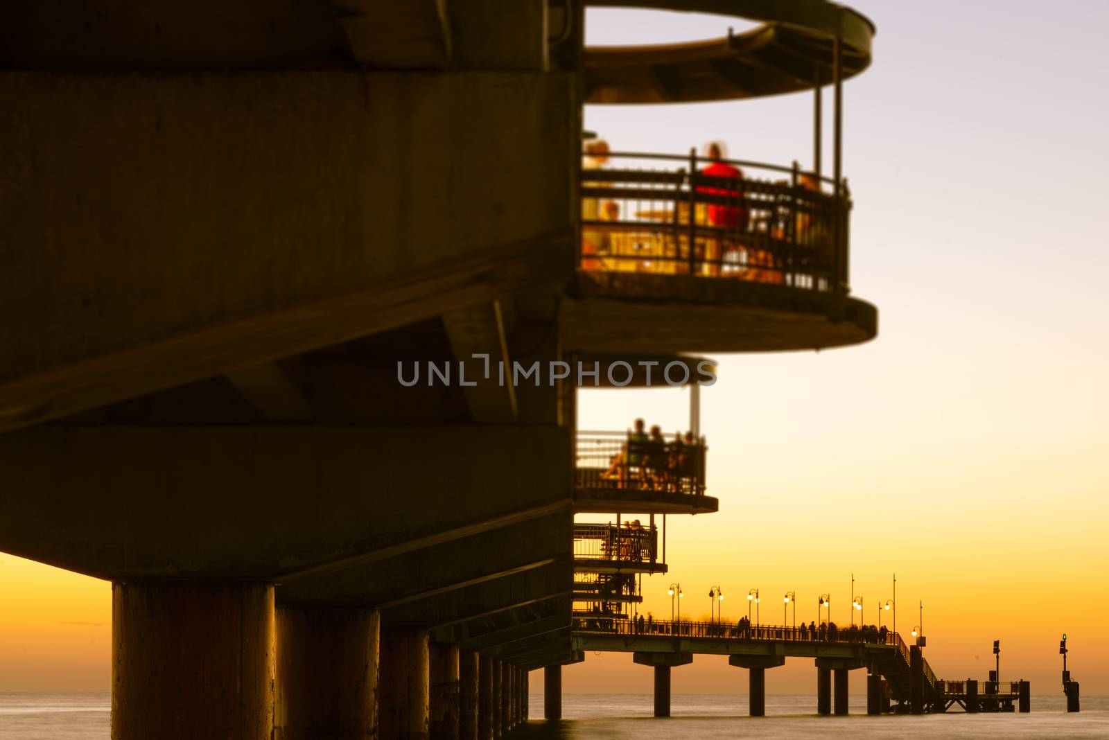 Baltic sea at beautiful sunset in Miedzyzdroje beach, city where the festival of stars takes place every year . Polish baltic coast. Famous city among the tourist. Pier at sunset