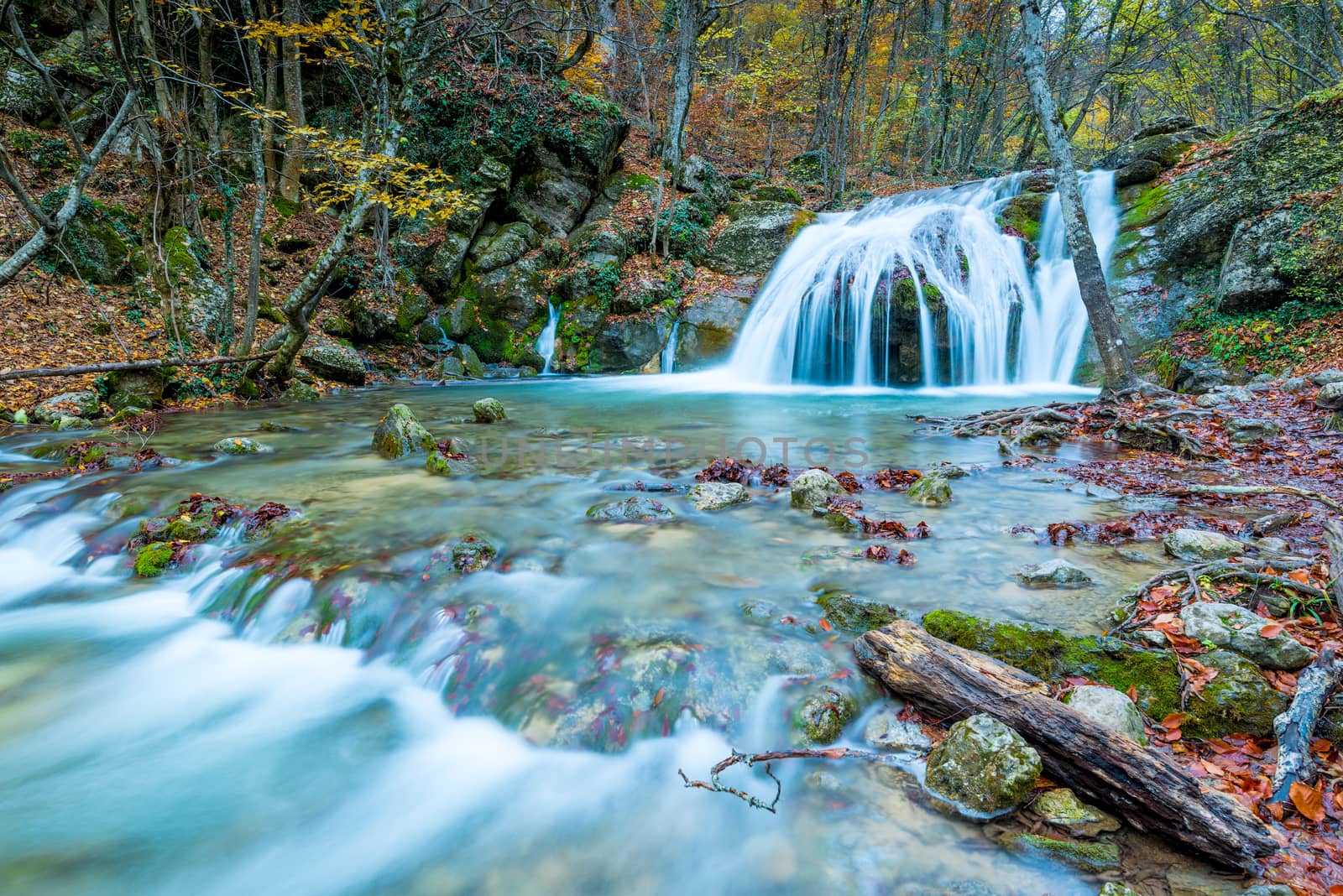 Scenic little waterfall, autumnal nature of the Crimea peninsula, Russia