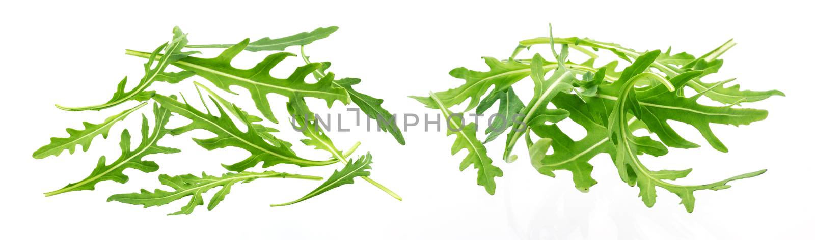 Heap of fresh rucola leaves isolated on white background with clipping path by xamtiw