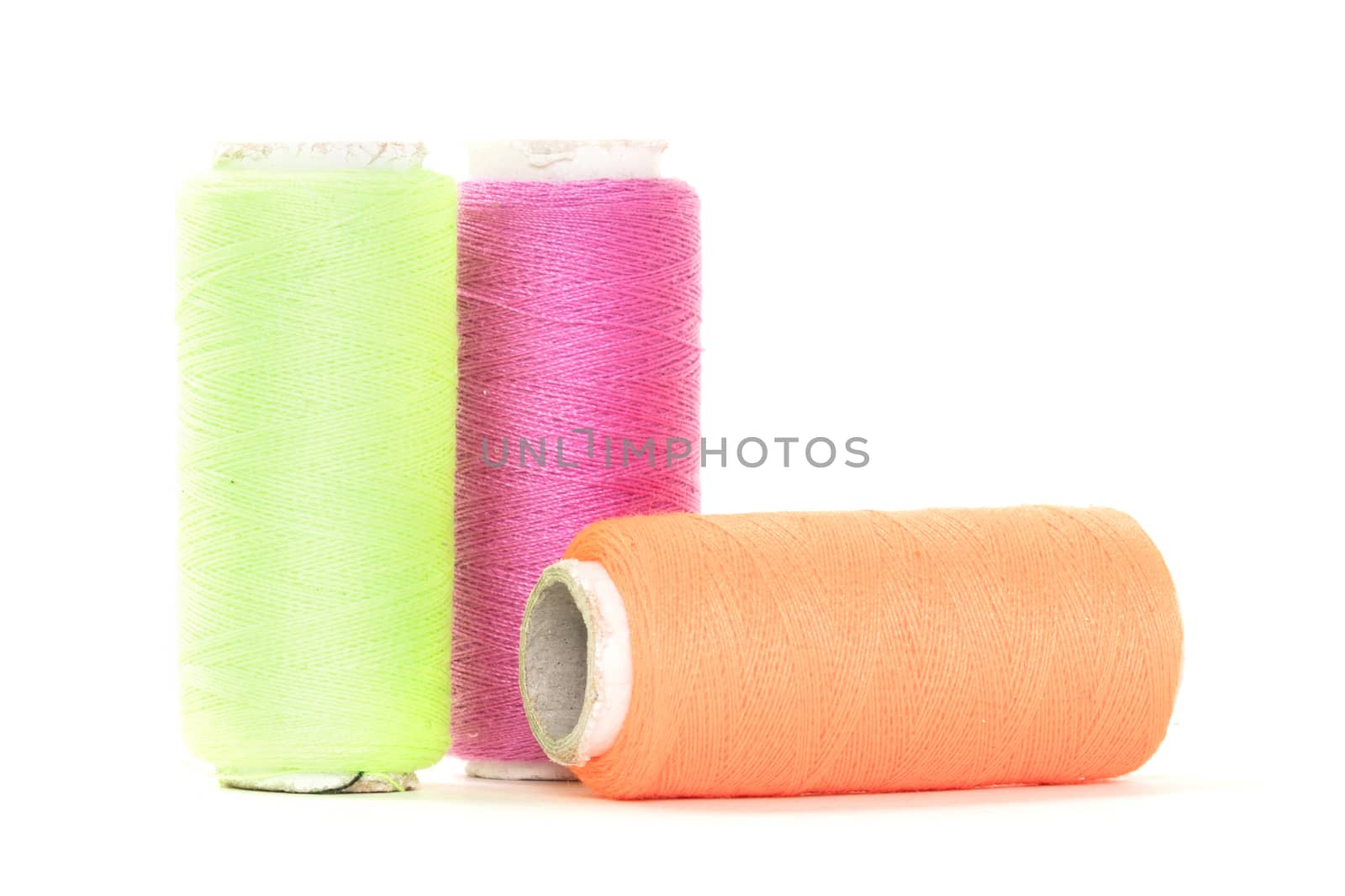 Color sewing thread with needle, isolated on a white background