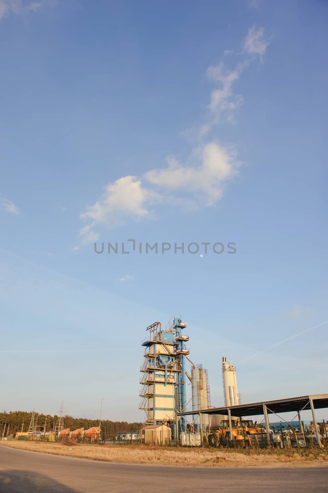 Modern industrial exterior building over blue sky
