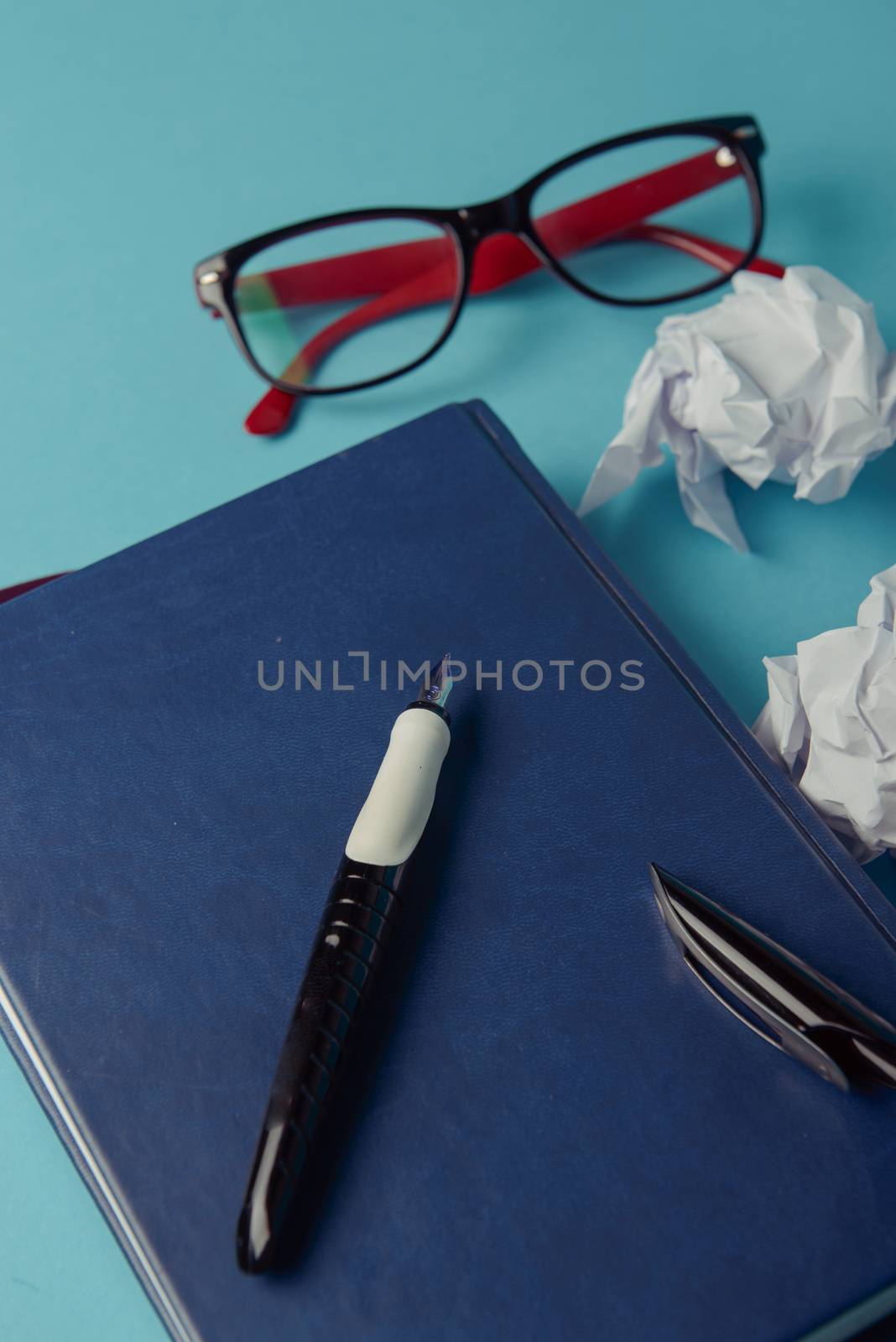 Desk with Tools and Notebook office desk on blue background
