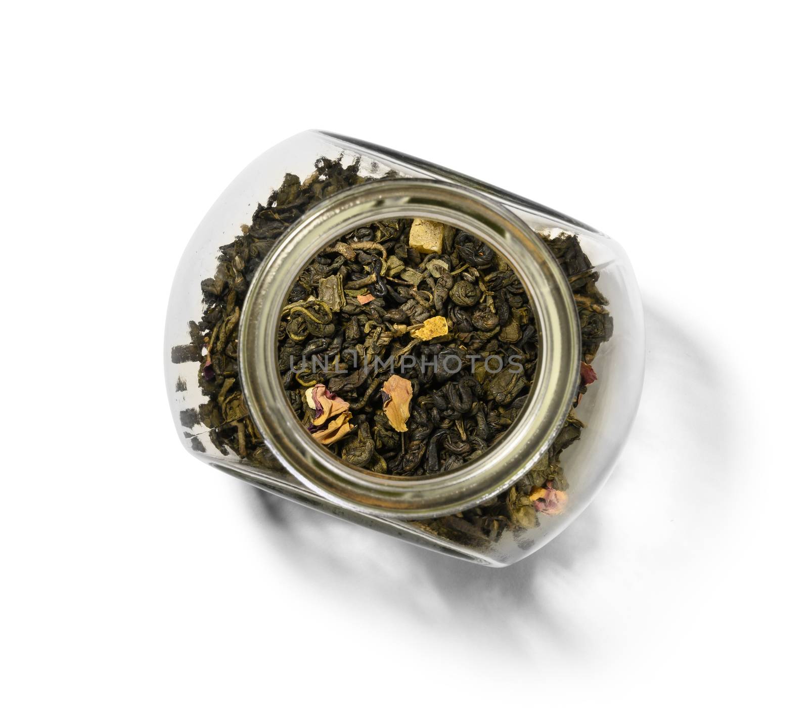 Green tea with aromatic additives. Top view on white background.