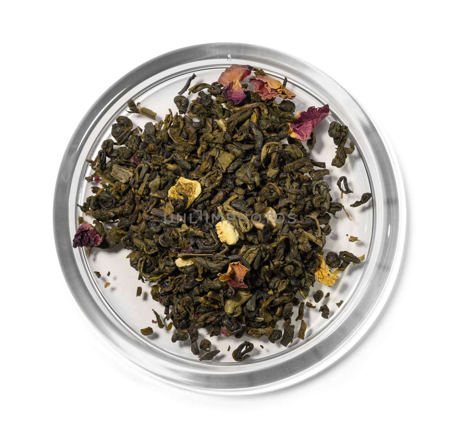 Green tea with aromatic additives. Top view on white background.
