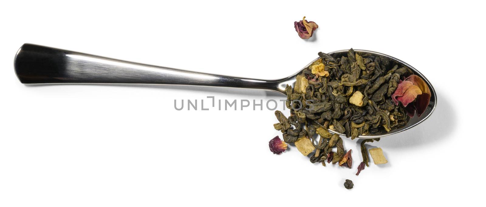 Spoon and green tea with aromatic additives on a white background by butenkow