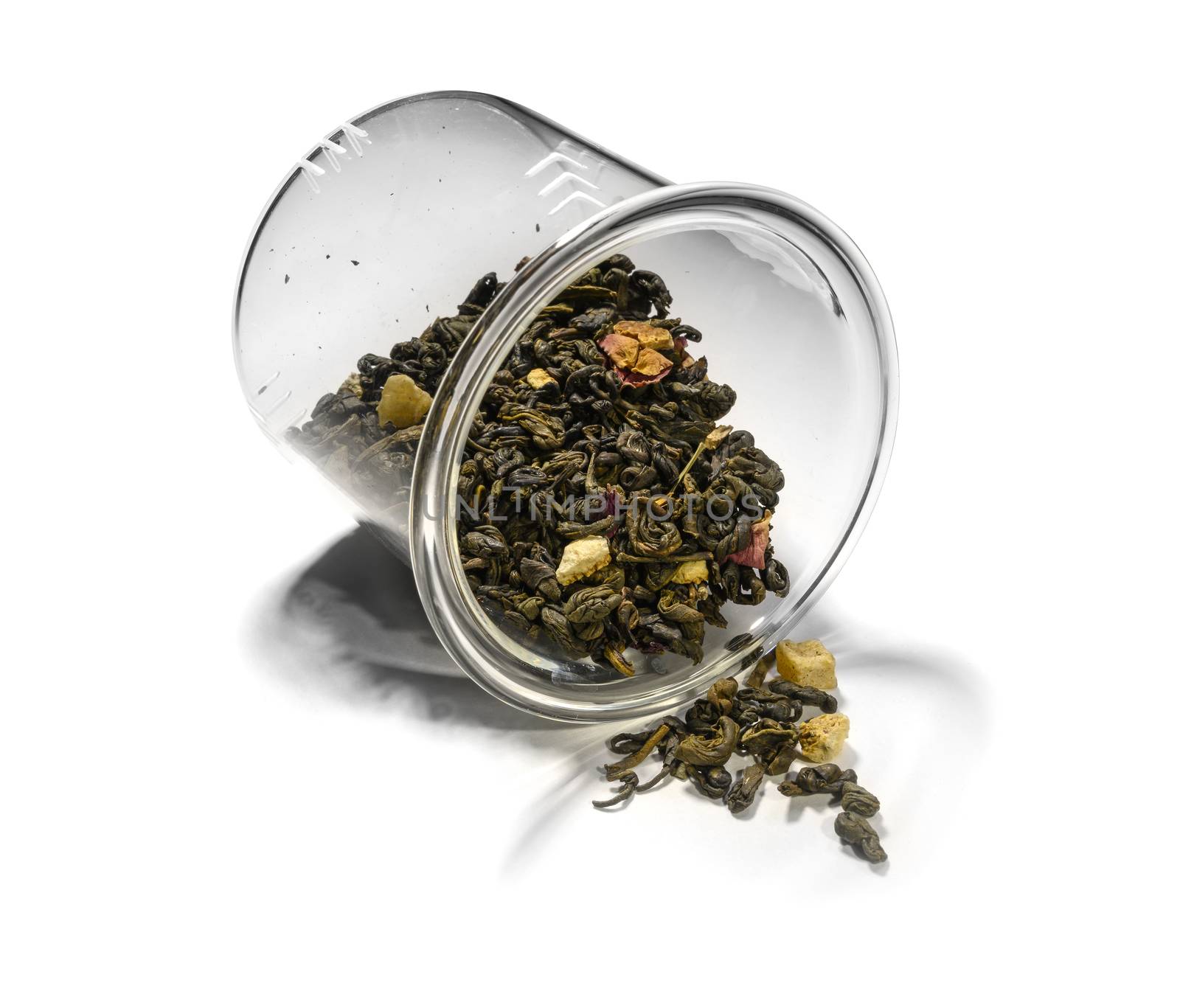 Green tea with aromatic additives. Top view on white background.