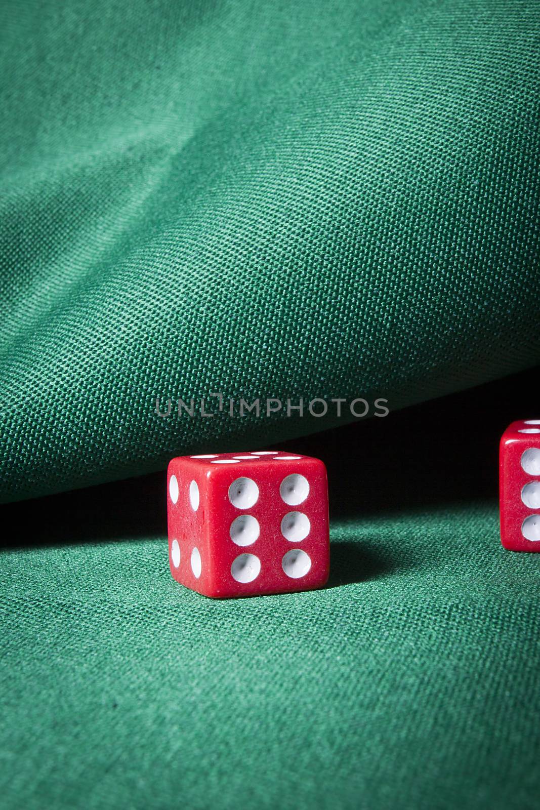 Dice on a table with green cloth