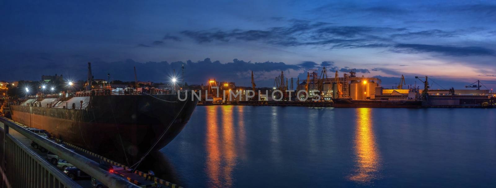 Panoramic view of the sea port and cargo terminal in Odessa, Ukraine, at the summer night