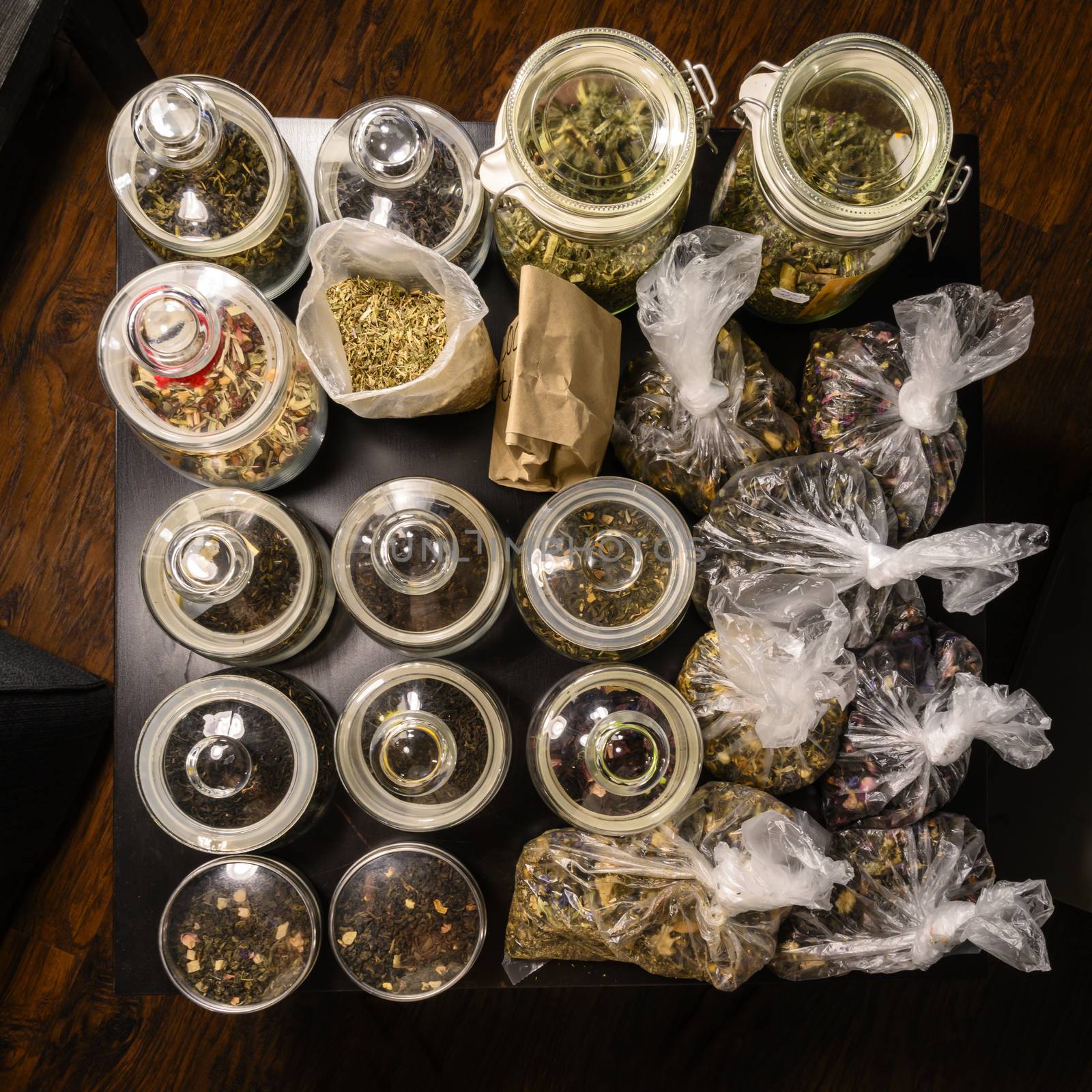 Set of teas in glass jars and bags.