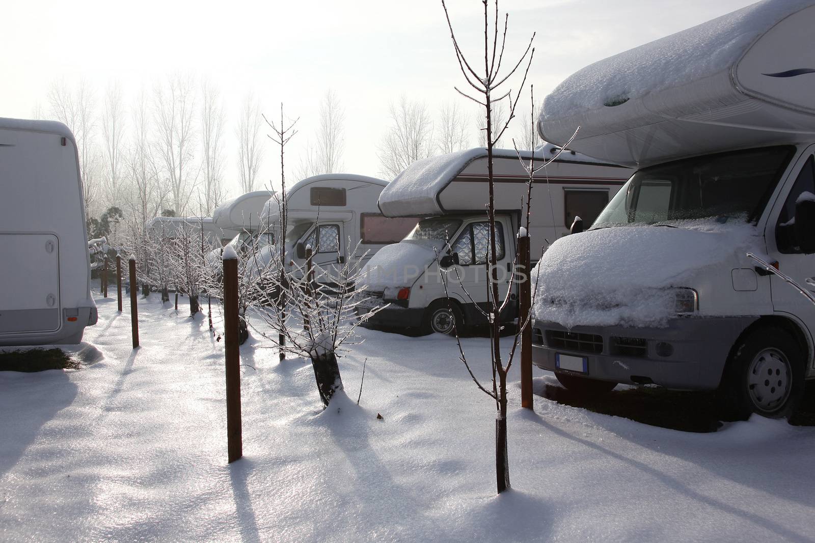 motorhome and caravan at winter with snow
