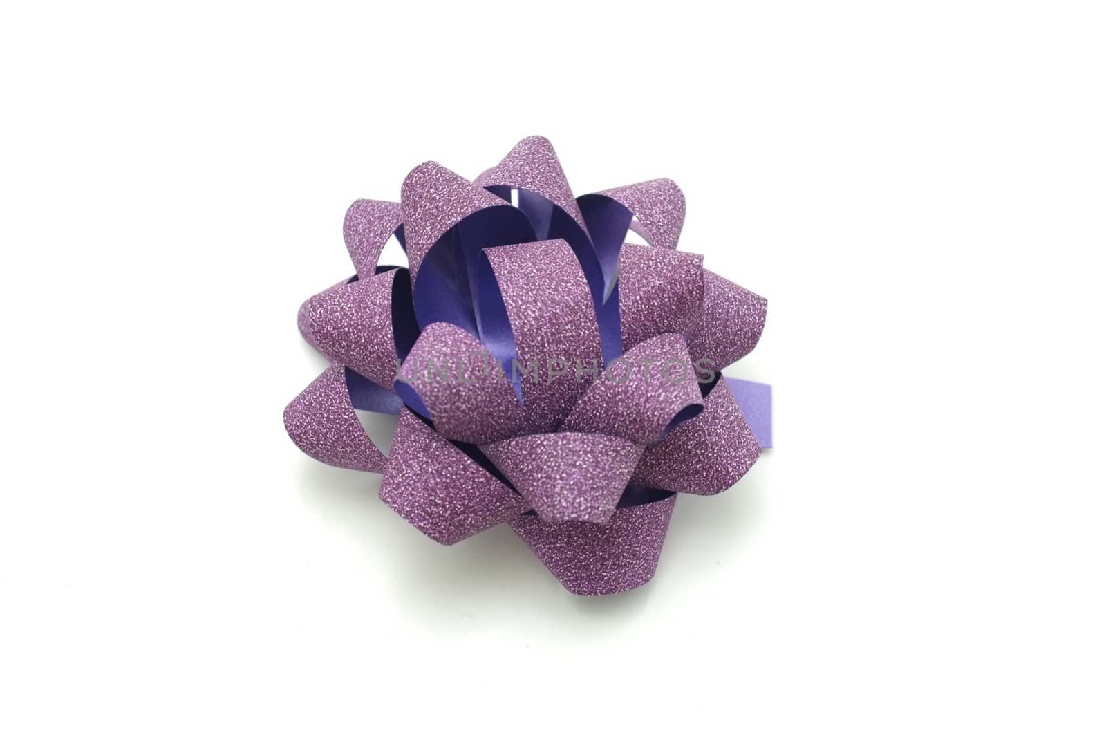 
Purple lush bow isolated over white background