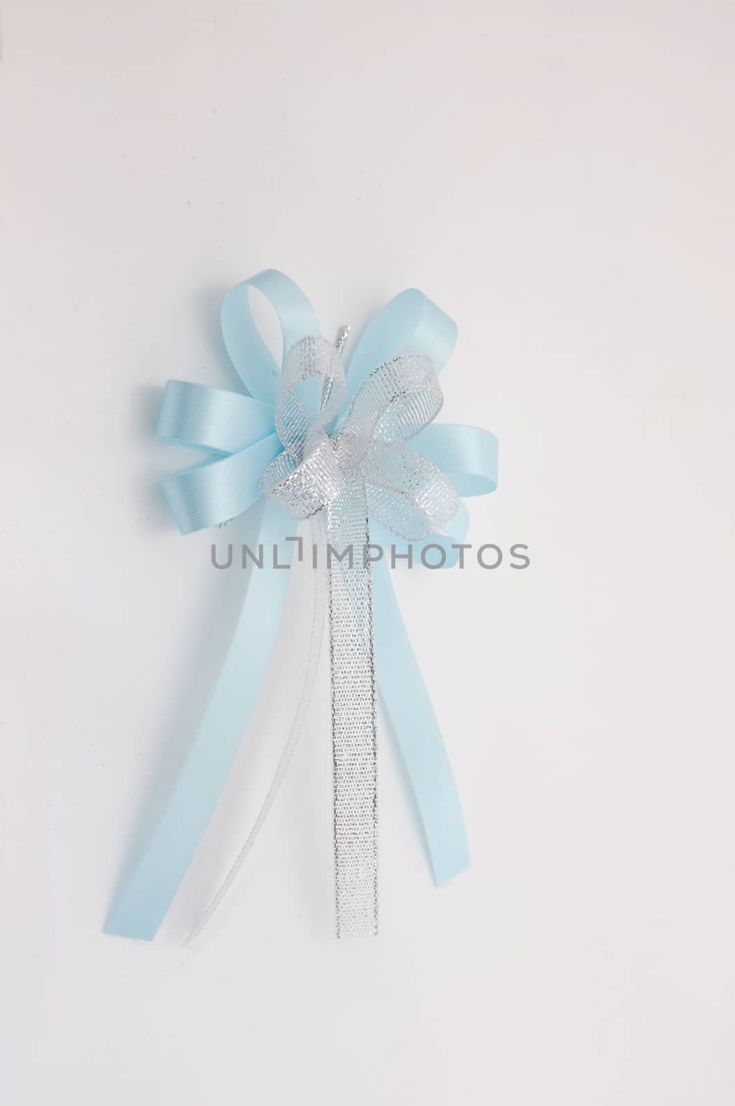 Blue lush bow isolated over white background