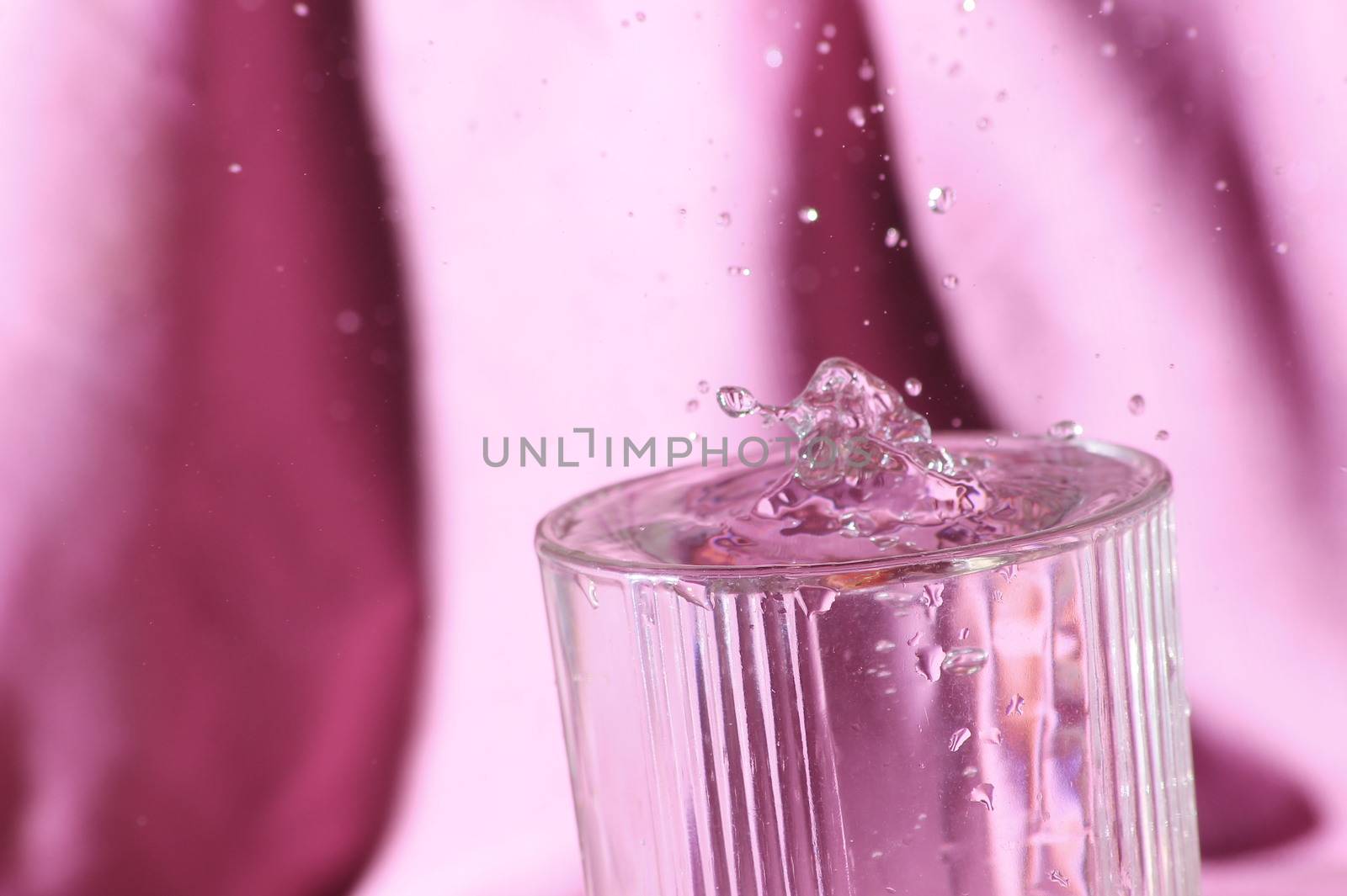 clear water drops pink background