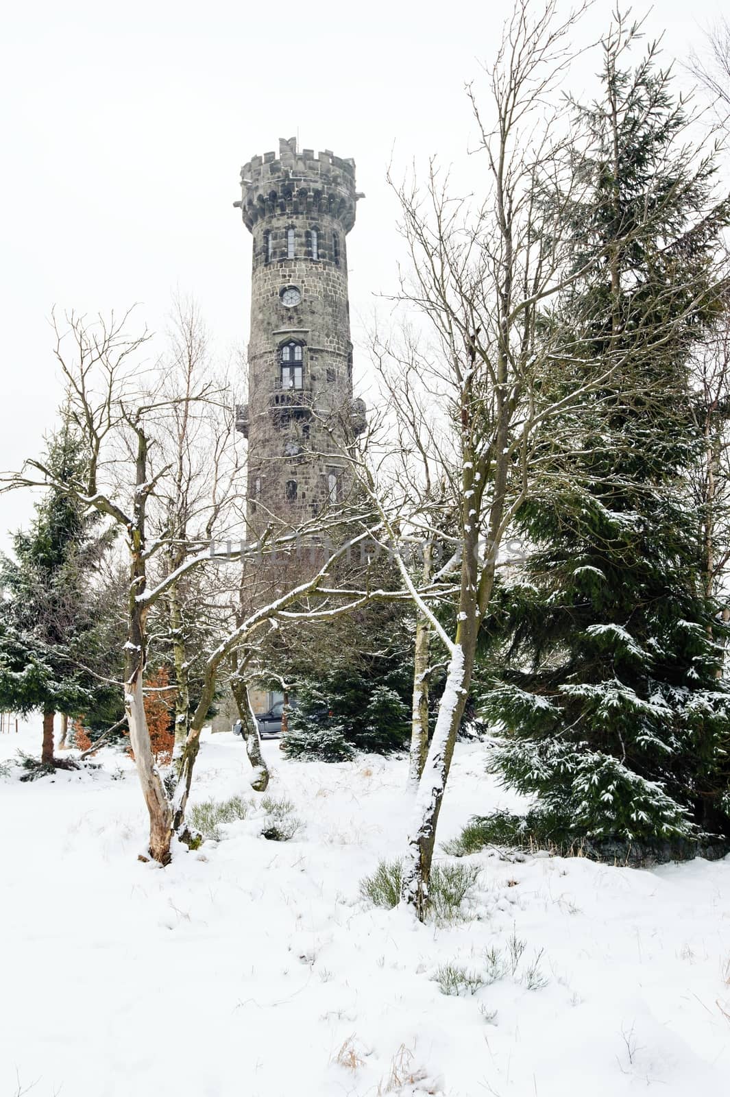 Winter landscape covered with snow and lookout tower