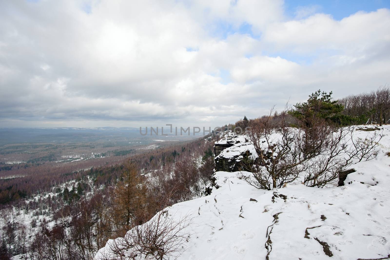 Winter landscape covered with snow and snow clouds