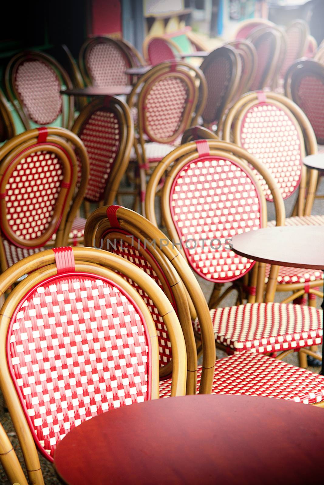 many Vintage chairs outside a pub