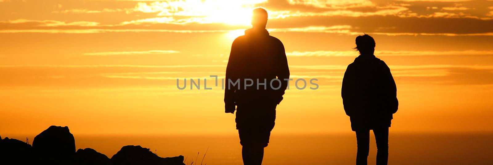a Couple strolling at sunset