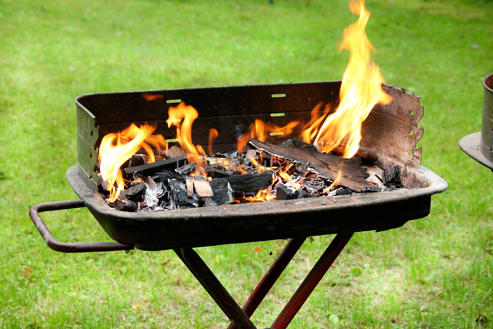 a burning barbecue ready for cooking
