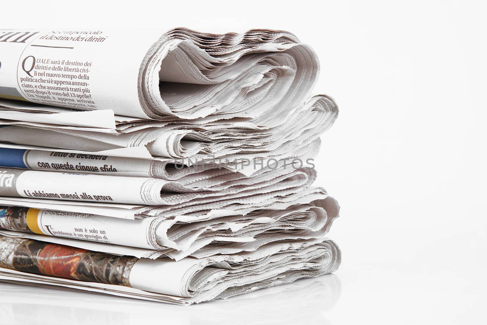 Newspapers folded in white background by photobeps