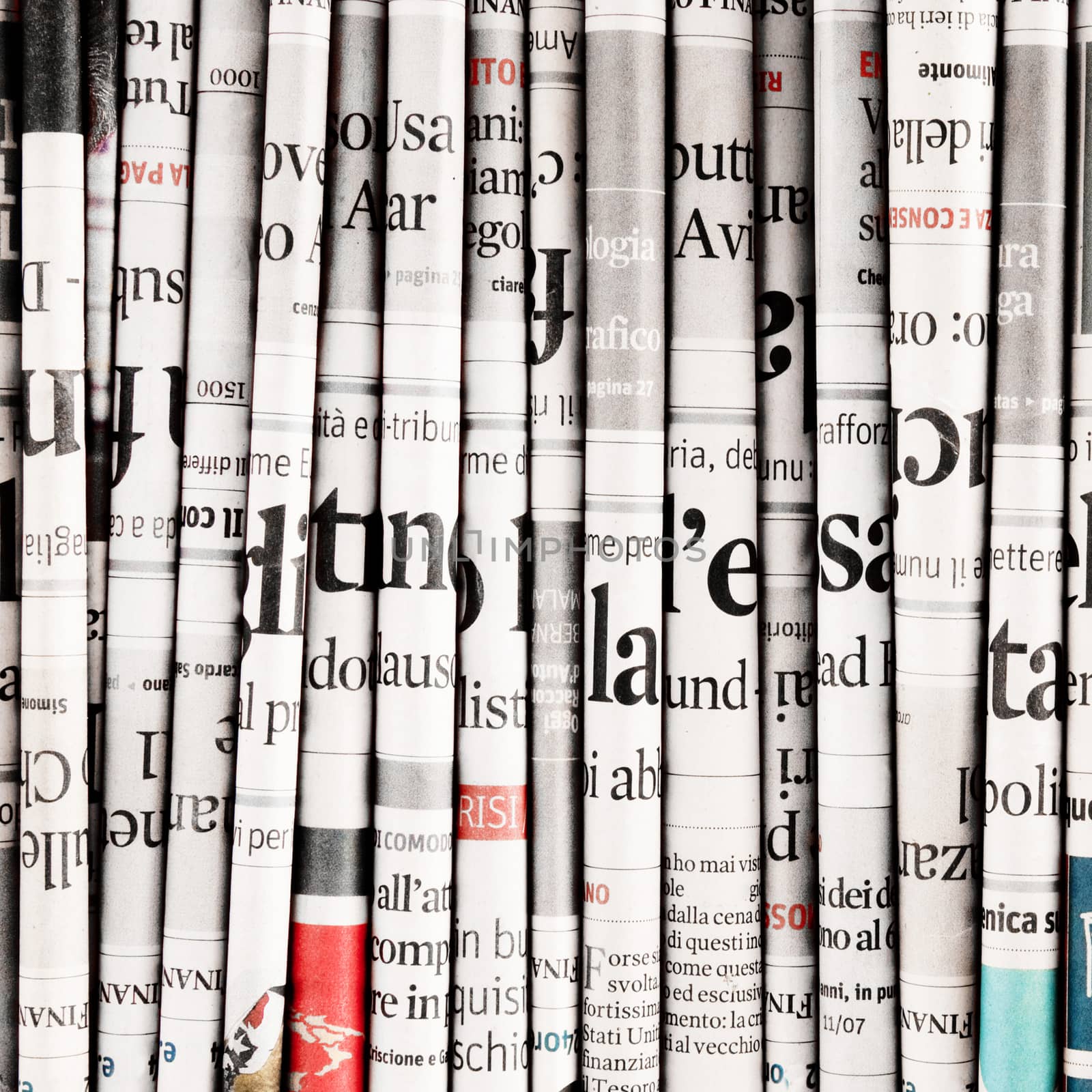 Newspapers folded to form a background by photobeps