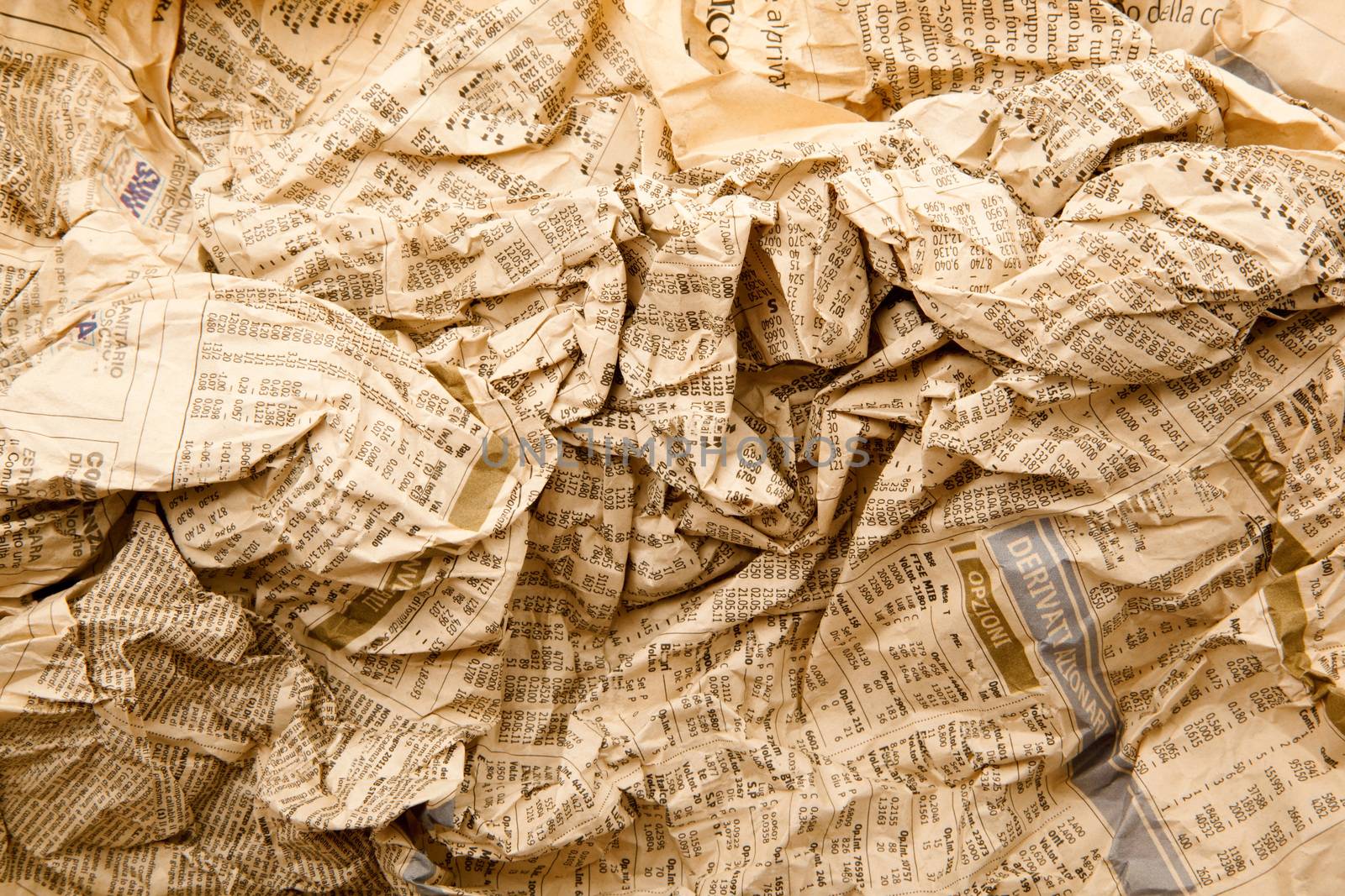 Newspapers folded and crushed to form a background