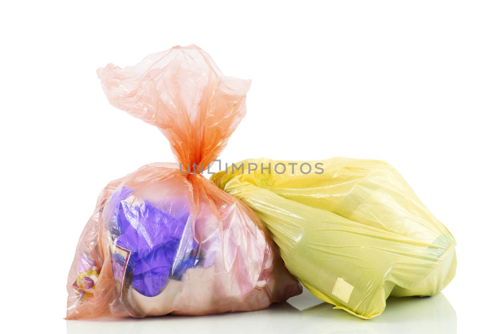 bags full of garbage on white background