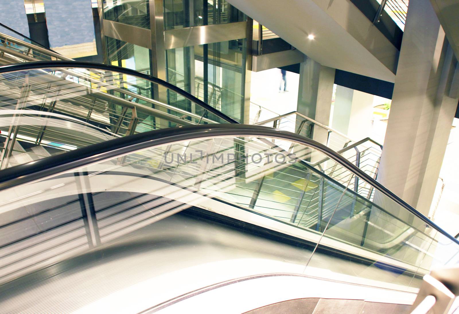 an escalator inside a shopping centre
