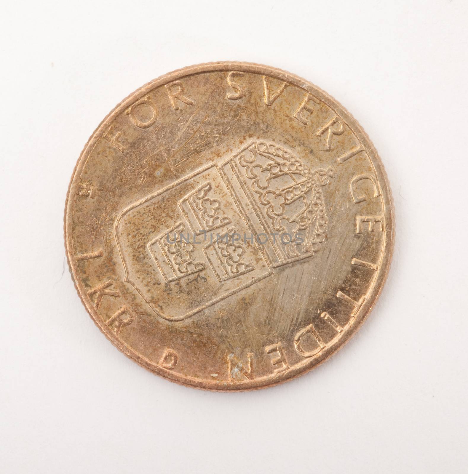 vintage metal coin on white background