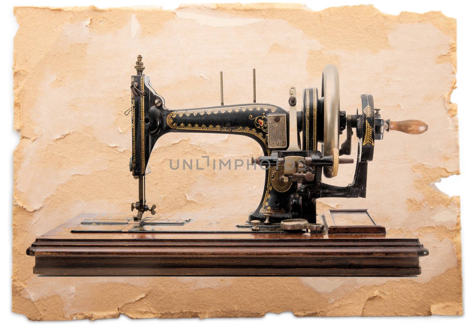 old sewing machine on vintage paper background