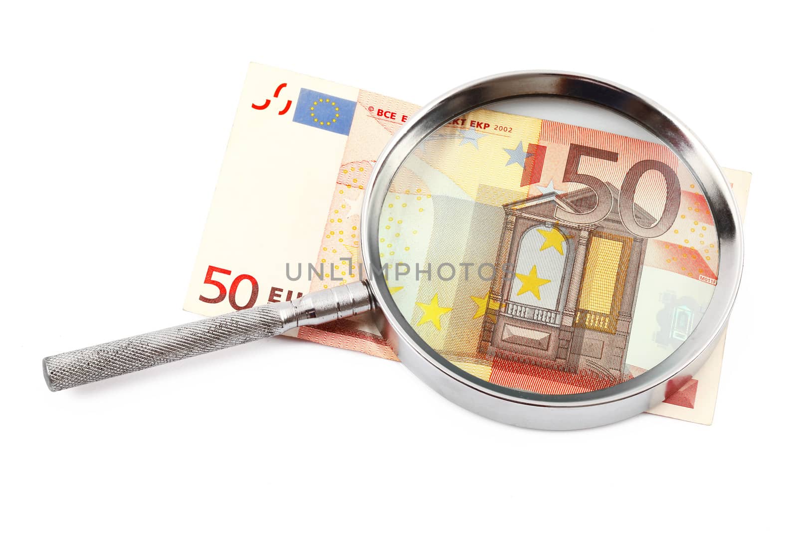 Money under magnifying glass on white background